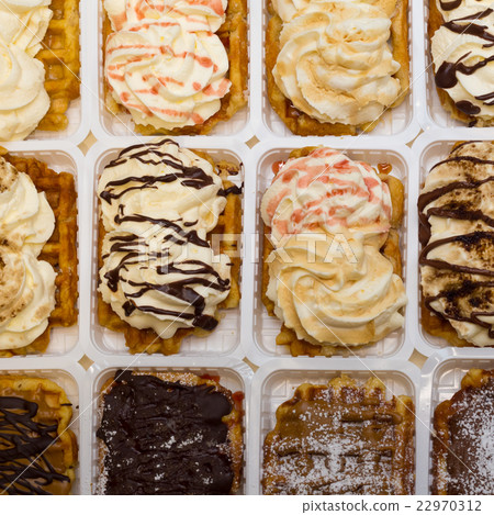 Assortment of Belgium waffles with cream and Assortment of Belgium waffles with cream and 22970312