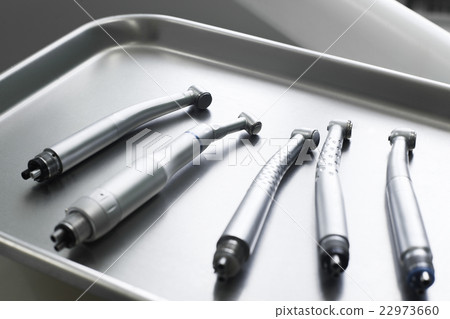 Dental turbine handpieces on metal tray closeup 22973660