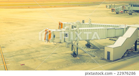 Airport terminal boarding gate . ( Filtered image processed vintage effect. ) Airport terminal boarding gate . ( Filtered image processed vintage effect. ) 22976286