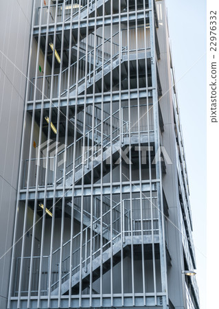 Metal fire escape outside building . 22976332