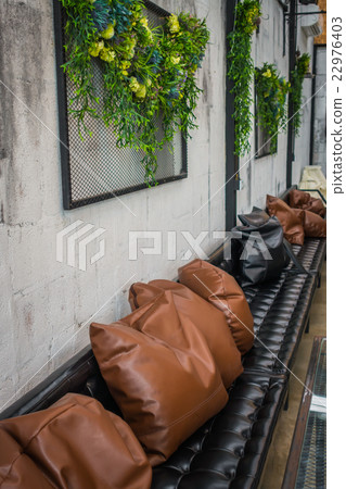 Tables and chairs in restaurant . 22976403