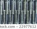 Screws placed alternately arranged in a row.  22977612