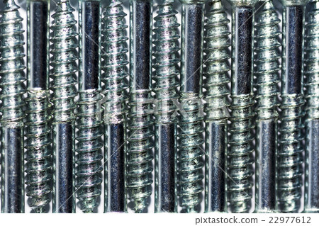 Screws placed alternately arranged in a row.  22977612