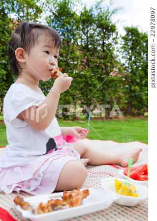 Little asian (thai) girl enjoy eating her lunch 22978097