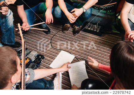 Musicians discussing new song top view Musicians discussing new song top view 22978742