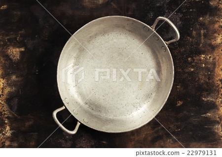 old empty cooking pot on rustic background old empty cooking pot on rustic background 22979131