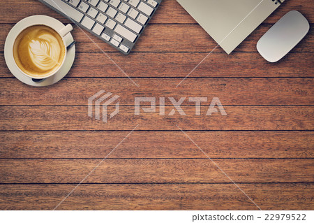 Office table with notepad, computer and coffee cup Office table with notepad, computer and coffee cup 22979522