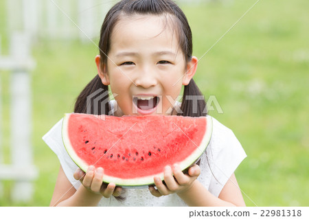 A girl who eats a watermelon A girl who eats a watermelon 22981318
