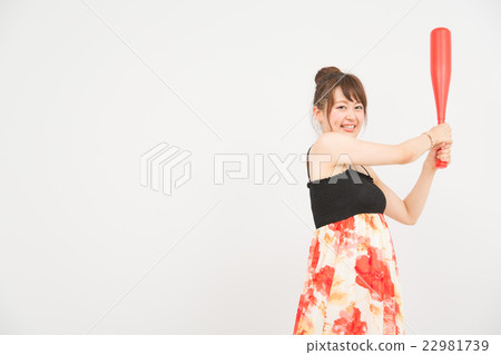 A woman with a bat A woman with a bat 22981739