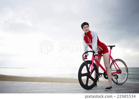 Young woman at seashore enjoying recreation time Young woman at seashore enjoying recreation time 22985534