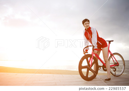 Female enjoying weekend stroll on rental bike Female enjoying weekend stroll on rental bike 22985537