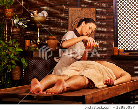 Man having Ayurvedic spa treatment. 22986057