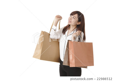 A young woman who enjoys shopping 22986512