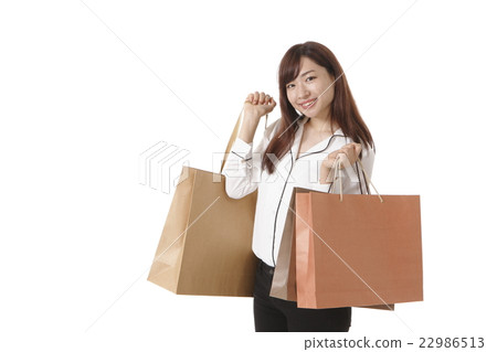 A young woman who enjoys shopping 22986513