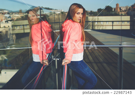 Attractive hipster girl posing outside 22987143