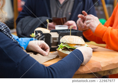 Beef burgers being served on street food stall 22987977