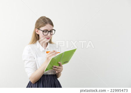 Foreign women with notes and pens Foreign women with notes and pens 22995473