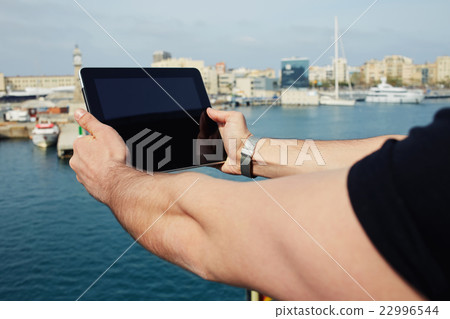 Male with digital tablet camera taking pictures Male with digital tablet camera taking pictures 22996544