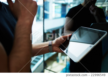 Businessman executive using wireless devices  22996549