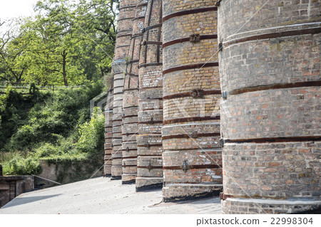 Former factory tiles and bricks tall chimneys Former factory tiles and bricks tall chimneys 22998304