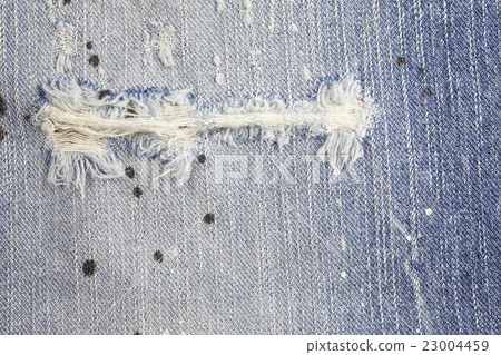 Torn denim jeans texture, Torn blue jean 23004459