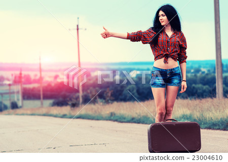 Beautiful girl stops the car 23004610