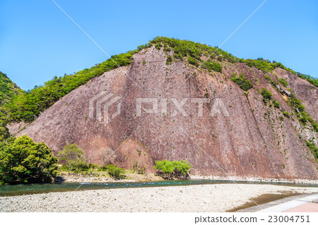 Monolith of the fresh green dazzling old River 23004751