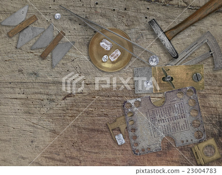 vintage jeweler tools over wooden bench vintage jeweler tools over wooden bench 23004783
