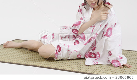 A young lady barely wearing a yukata 23005905