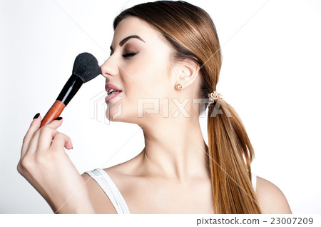 Emotional portrait of a young beautiful girl  23007209