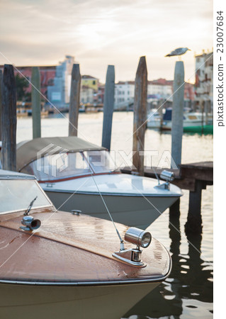 riva boat parked on the canal in Venice 23007684