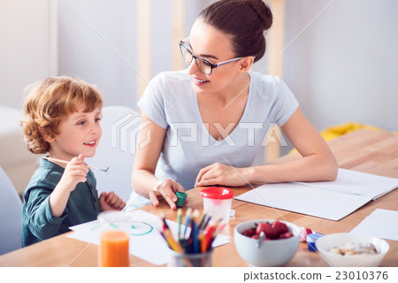 Son and mother painting together Son and mother painting together 23010376