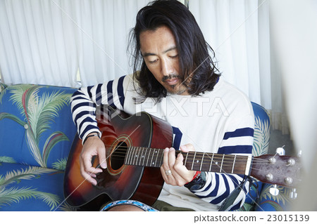 Man playing guitar Man playing guitar 23015139