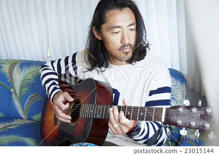 Man playing guitar Man playing guitar 23015144