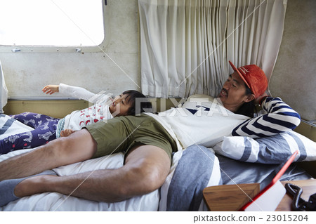 Parents relaxing in bed Parents relaxing in bed 23015204