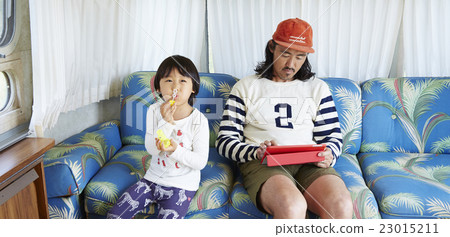 Parents playing with soap bubbles 23015211