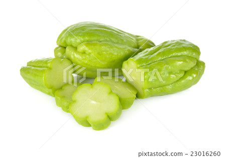 whole and sliced fresh chayote on white background 23016260