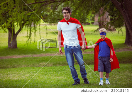 Father and son pretending to be superhero 23018145