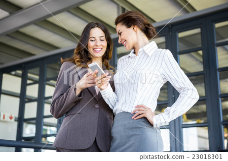 Beautiful young businesswomen in office 23018301