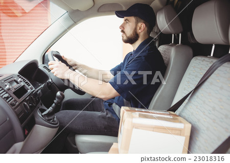 Delivery man driving his van Delivery man driving his van 23018316