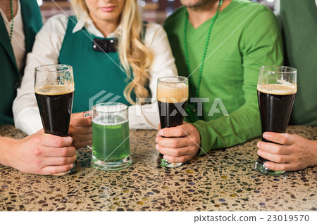Friends holding beers 23019570