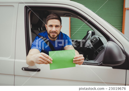Man sitting in his van 23019676