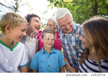 Smiling family standing and laughing 23019734