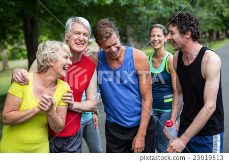 Marathon athletes posing and laughing 23019813