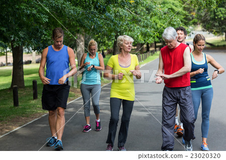 Marathon athletes taking their heart rate 23020320