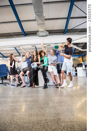 Group of businesspeople interacting during break time Group of businesspeople interacting during break time 23020378