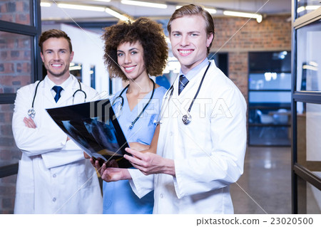 Group of doctors with xray report Group of doctors with xray report 23020500