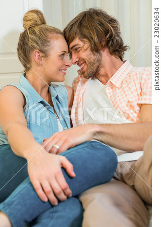 Cute couple lovingly looking at each other Cute couple lovingly looking at each other 23020634