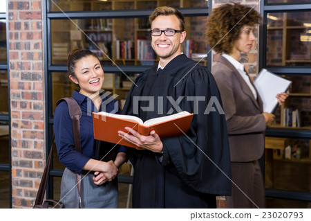 Lawyer and businesswoman standing near library 23020793