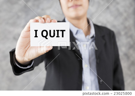 man presenting business card with word I quit 23025800